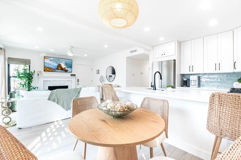 Bright, modern living meets coastal ease in the open-plan living and dining area, relax, stream, dine and unwind in style