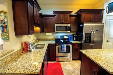 With high-end appliances and abundant cabinetry, this fully stocked kitchen is ready for all your cooking and dining adventures.