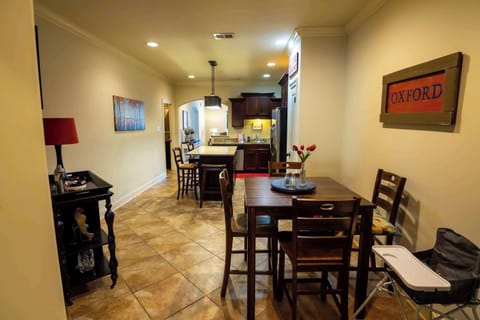 Right next to the kitchen, the dining area is perfectly situated for easy meals, whether it’s a casual breakfast or a festive family dinner.