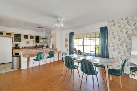 The dining area is bright and airy with a cheerful and inviting atmosphere.