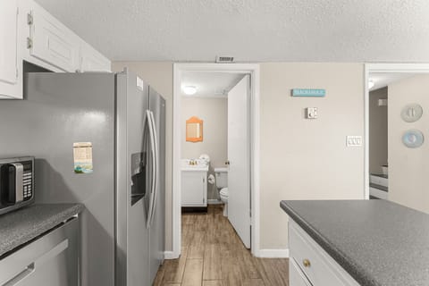 Kitchen/Half Bath/Laundry - On the first floor of the condo you have a half bath and laundry room conveniently located next to the kitchen.