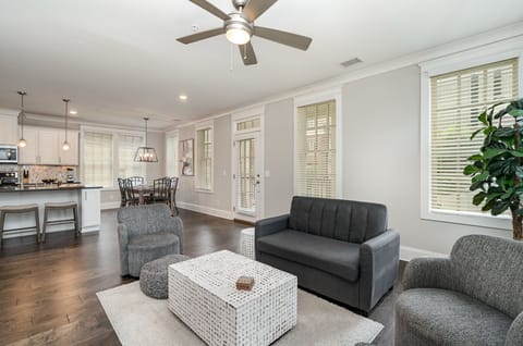 Unit 1: Open and inviting living space featuring a Smart TV and cozy furnishings.