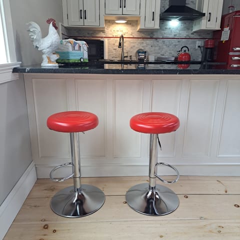 Bar stools at kitchen counter.