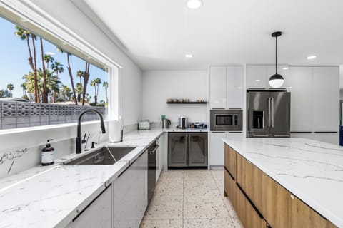 Chef's kitchen with a huge island for three