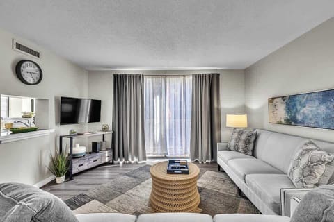 Modern living room with natural light and comfortable seating