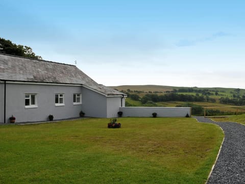 The outside of Llaethdy Rachel and lawn to the front