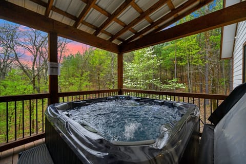 Your forest retreat begins here—private hot tub, crackling fire, and nature all around.