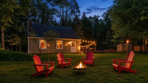 Twinkling lights and a crackling fire pit welcome you home after dark.