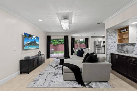 Our open-concept floor plan is spacious, with plenty of room to gather and relax in the living room while crafting a cocktail at the bar area.