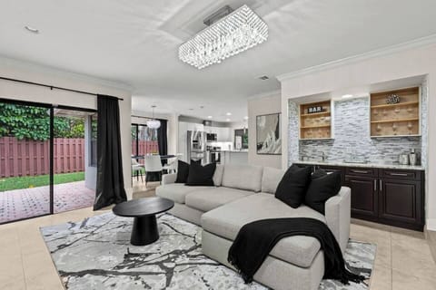 Our open-concept floor plan is spacious, with plenty of room to gather and relax in the living room while crafting a cocktail at the bar area.