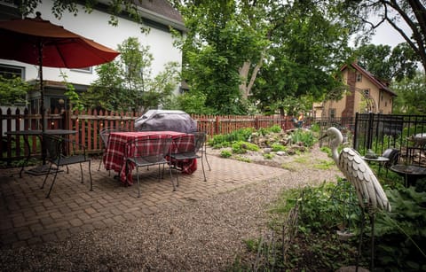 Lovely outdoor seating with grill and garden