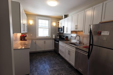 Modern kitchen with washer and dryer