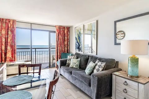 Relax in this oceanfront comfy Livingroom with direct oceanfront views and plush couch and seating.  Expand the couch into a sofa sleeper at night to entertain 2 additional guests. This beach themed condo is the perfect spot to make lasting memories.