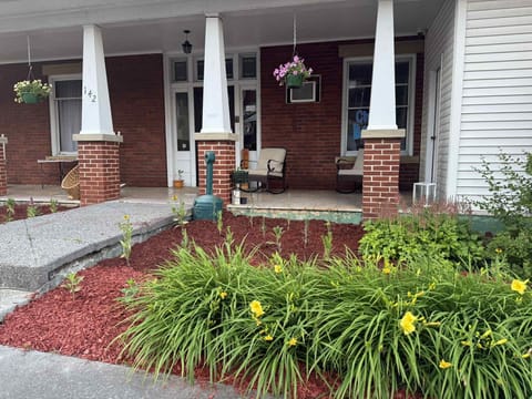 Front porch with lots of seating as well as a bar area
