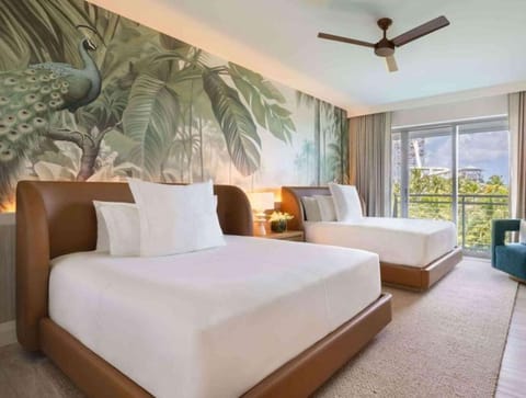 Unwind in a bright twin room with breezy balcony views.