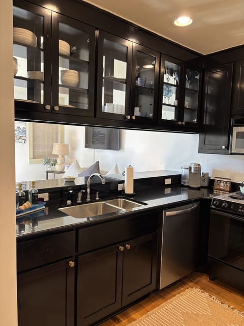 The Space is Adorned With a Fully Stocked Kitchen, Including Barware