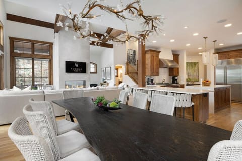 Spacious open-concept living, dining, and kitchen area with elegant decor and natural light.