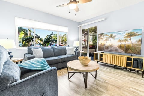 Enjoy a bright living room with a wide window that fills the space with natural light and a warm, welcoming glow