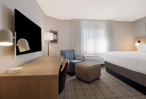 Wake to gentle daylight and a beautifully made, cozy bed.
