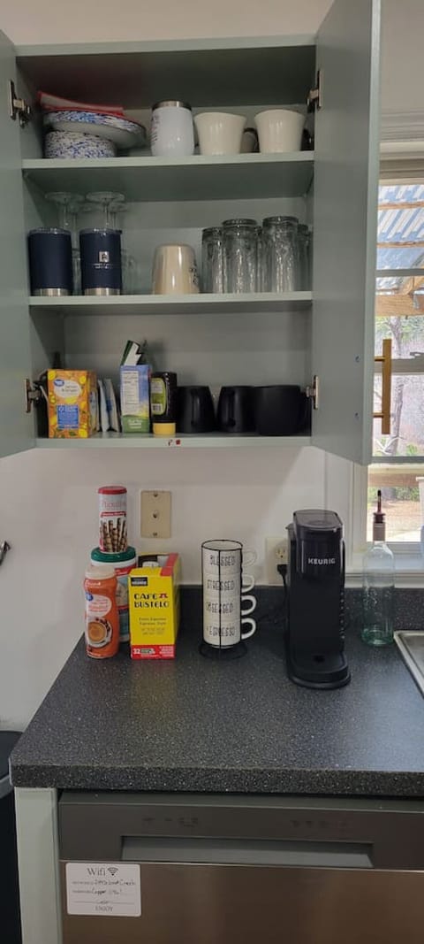 Everything you need is at your fingertips, from a double-basin sink with a picturesque window view of Great Creek to modern appliances like a microwave, Keurig, and a fridge-freezer combo with an ice and water dispenser. Ample cabinet space and a kitchen 