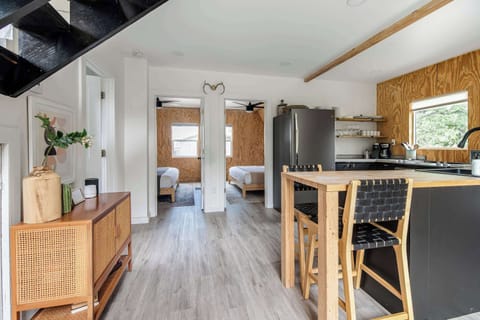 Hallway leads to two King-size bedrooms and shared bathroom.