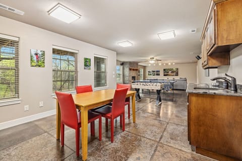 The game room has seating for four, providing the perfect space for fun, friendly competition, and relaxation between matches.