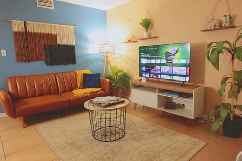 Relax in this cozy living space with a Smart TV!