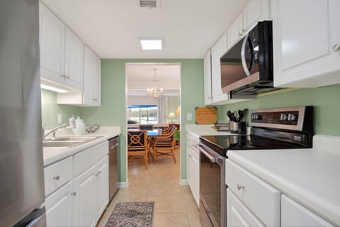 Kitchen off dining room with access to laundry room