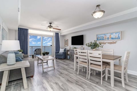 Open-concept living and dining area with sweeping ocean views and plenty of room to relax together.