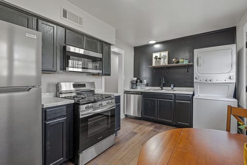 Kitchen equipped with all things cooking. Fridge, Stove, Dishwasher, Microwave