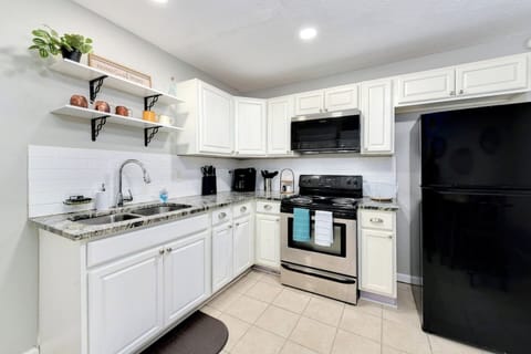 Spacious kitchen with dining table, and fully stocked to cook at home