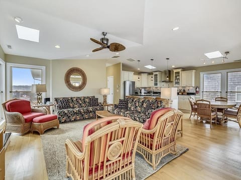 Another angle of the living area highlights the warm decor, natural light, and a comfortable ambiance perfect for relaxation or entertaining.