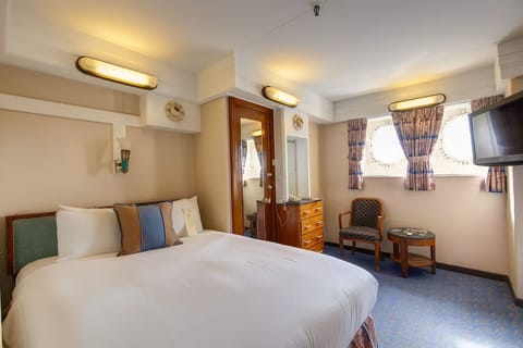 Wake to soft daylight glowing through charming porthole windows.