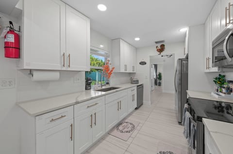 Perfect for any at-home chef, the fully equipped kitchen is ready for you to prepare all your favorite meals. Take advantage of the spacious kitchen and dining area to create a delicious feast for friends & family.  We provide refrigerator, oven, dishwasher, microwave, blender, toaster, hand mixer, pots & pans, colander, baking sheet, cake pan, plates, bowls, steak knives, flat...