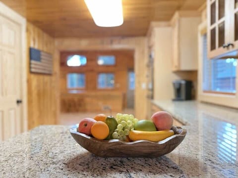 A fruit bowl 0n the counter for those quick to go snacks.