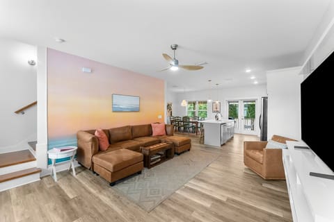 Spacious living room with a sectional and smart TV