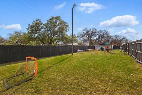 “Spacious Fenced Shared Yard with Room to Play” Whether it’s a family soccer match or kids running free, this large backyard offers plenty of open space to enjoy outdoor fun and games.