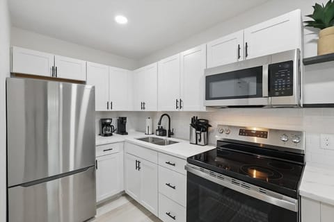 “Sleek & Functional Kitchen Setup” Whip up your favorite meals with modern appliances, a full knife set, and ample counter space — all in a clean, stylish design.