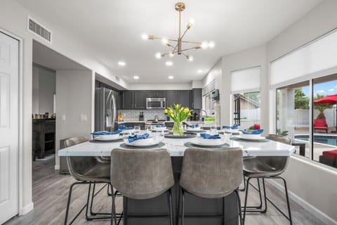 Gather around! The spacious dining table comfortably seats eight for family meals or festive dinners.