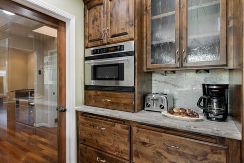 Welcome to gourmet paradise! Our kitchen boasts granite countertops and sleek appliances, providing the perfect setting for culinary adventures and memorable dining experiences.