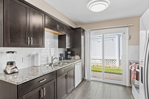 Sleek kitchen with stainless steel appliances and elegant finishes.