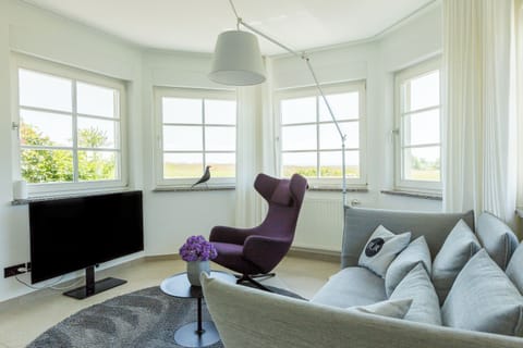 Bright Living Room with Sofa and Reading Chair
