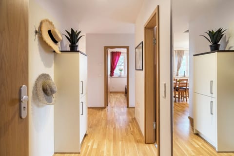 Modern hallway with cabinets and plants
