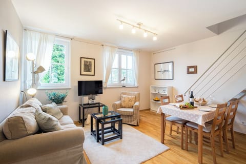 Bright Living Room with Sofa and Dining Table