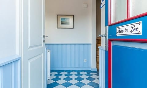 Entrance Area with Blue Walls and Tiles