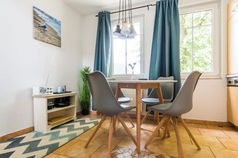Modern Kitchen with Dining Table and Windows