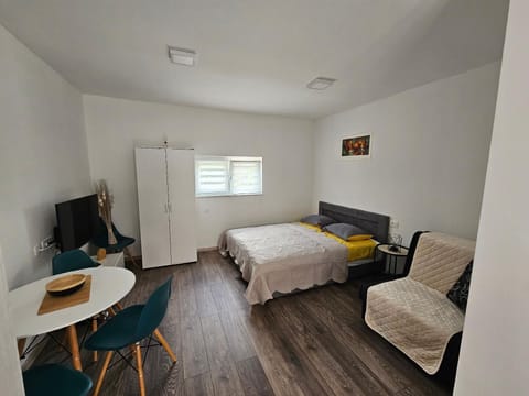 Studio apartment with double bed and folding sofa chair for one person