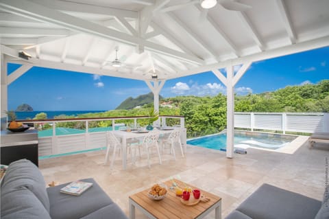 Luxury villa in Martinique with a beautiful outdoor living space overlooking the sea and Diamond Rock.