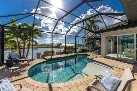 Heated pool overlooking the peaceful canal at this waterfront Englewood retreat