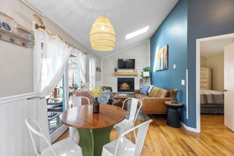 The kitchen table seamlessly connects to the living area, creating a spacious, open feel.